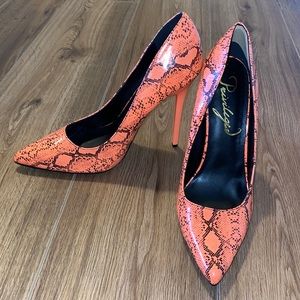 Orange snake skin high heels.